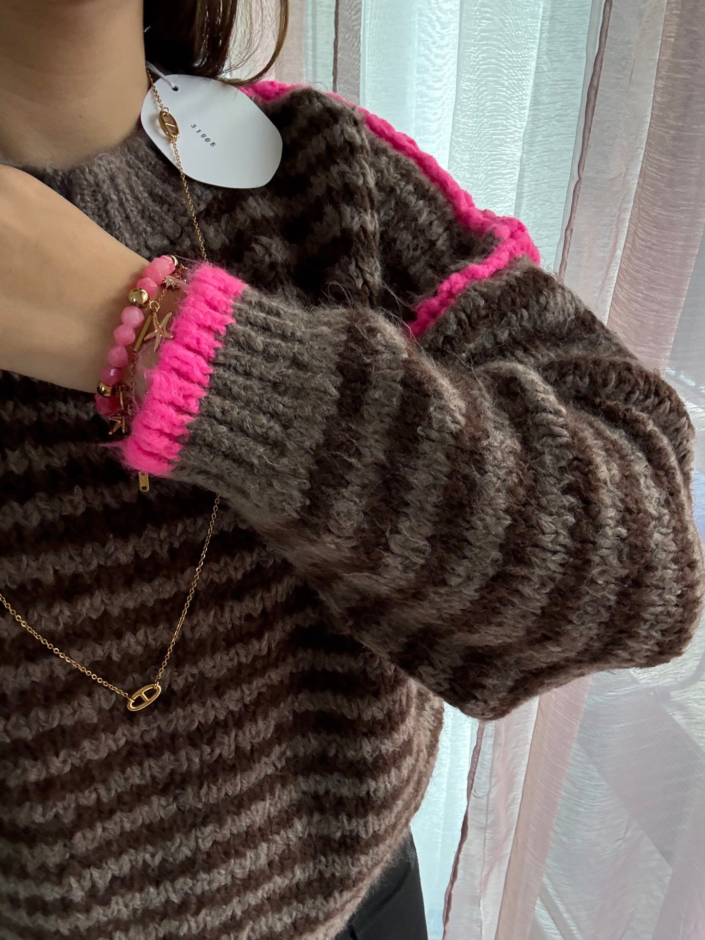 Pull surpiqûres choco fushia