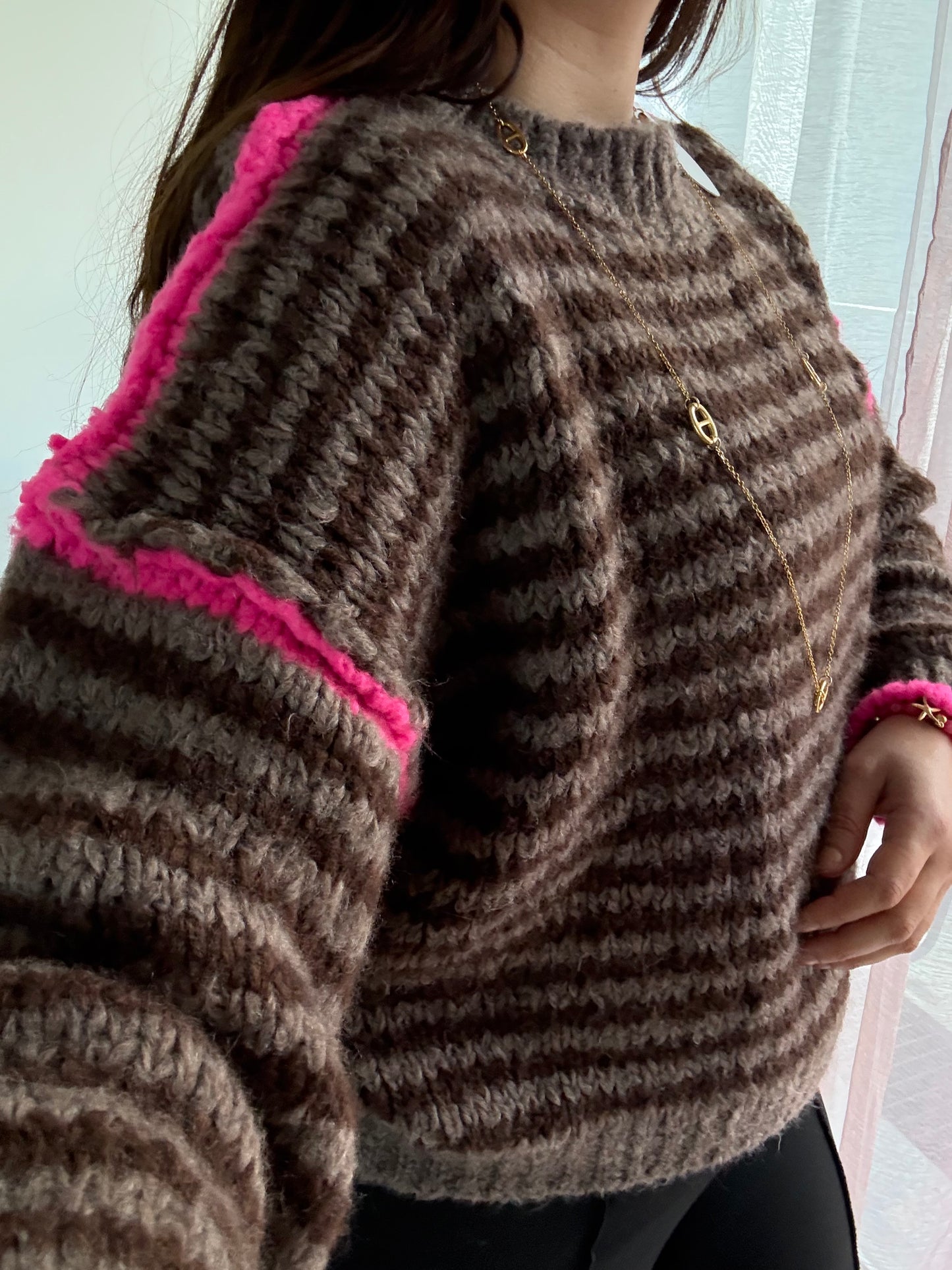 Pull surpiqûres choco fushia