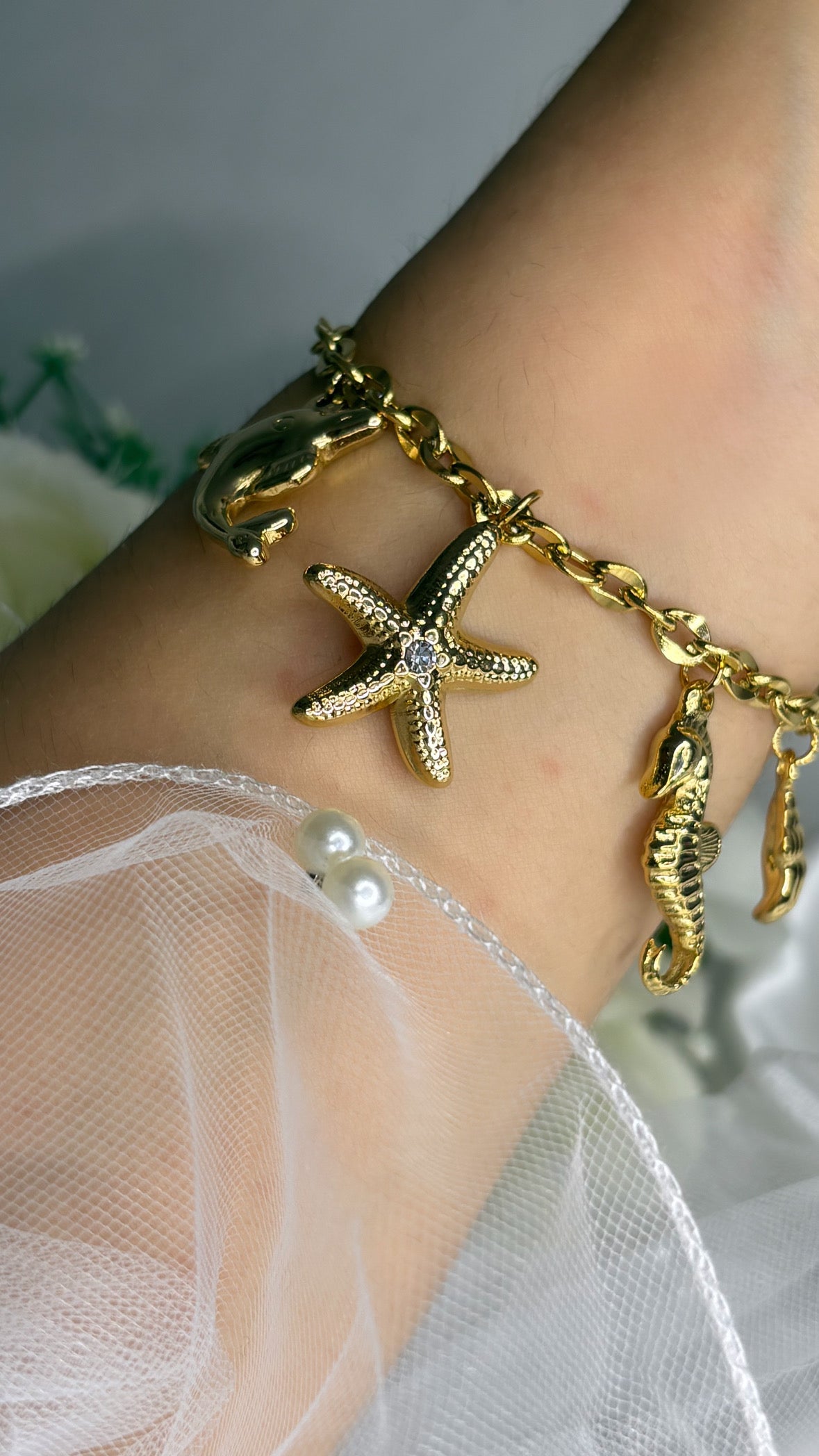 Bracelet breloque marin doré